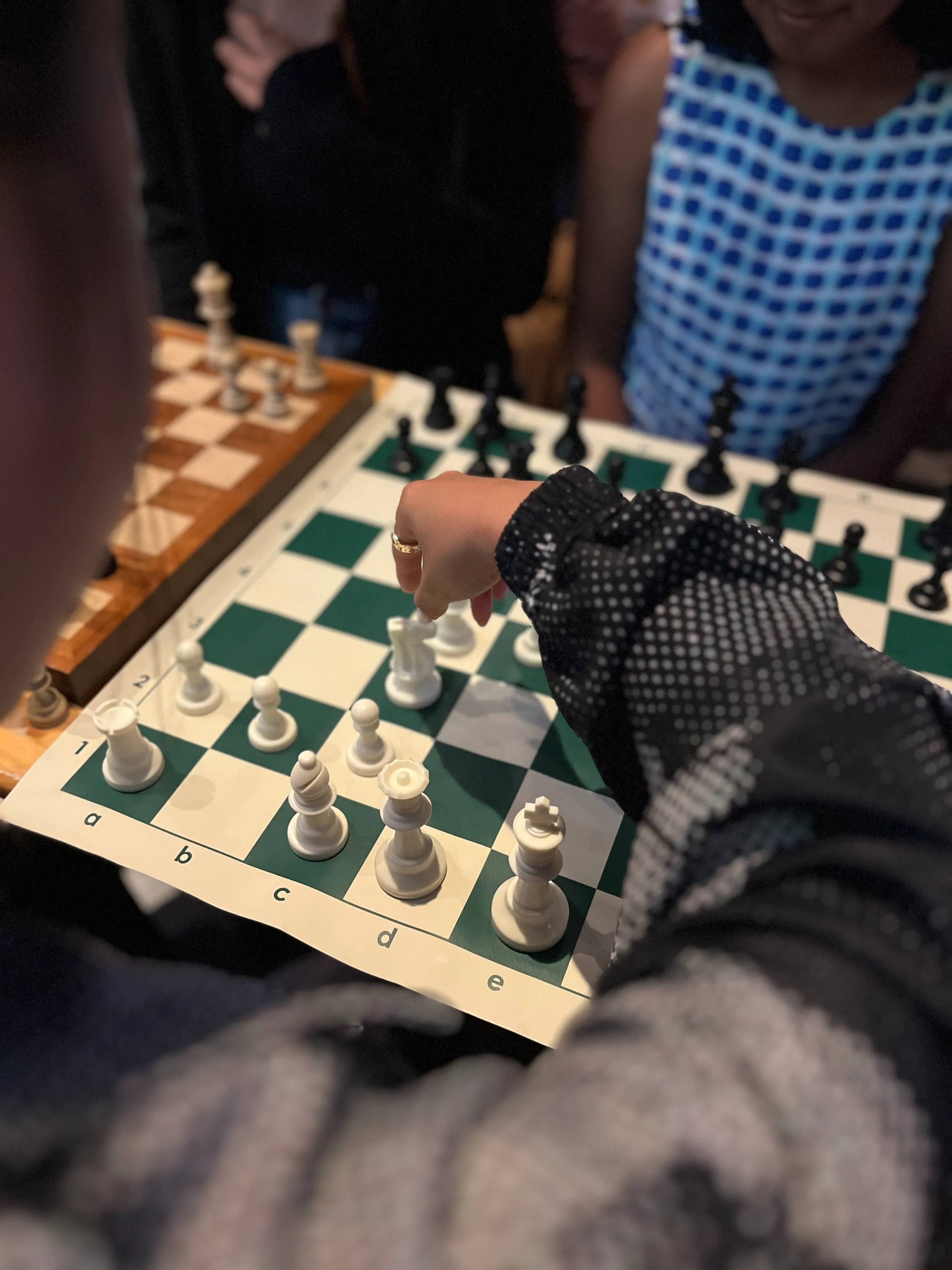 Hand moving a chess piece